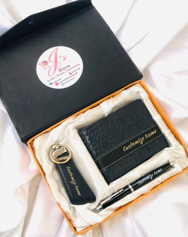 Blue leather crocodile style wallet, keychain, and pen set with customized golden name engraving on wallet and keychain, and white engraving on pen. It comes in a beautiful silk box with white colored silk clothing.