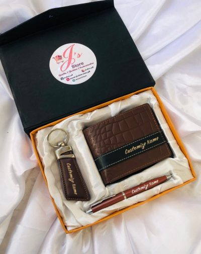 Brown crocodile style leather wallet, keychain, and pen set with customized golden name engraving on wallet and keychain, and white engraving on pen. It comes in a beautiful silk box with white colored silk clothing.