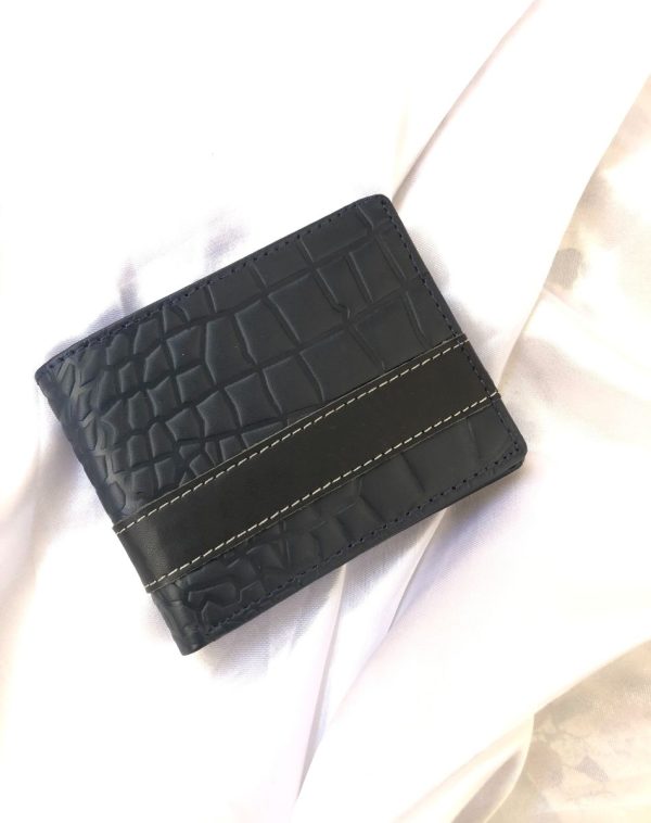 Blue leather crocodile style wallet with golden customized name engraving.