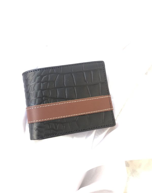 Black leather crocodile style wallet with golden customized name engraving.