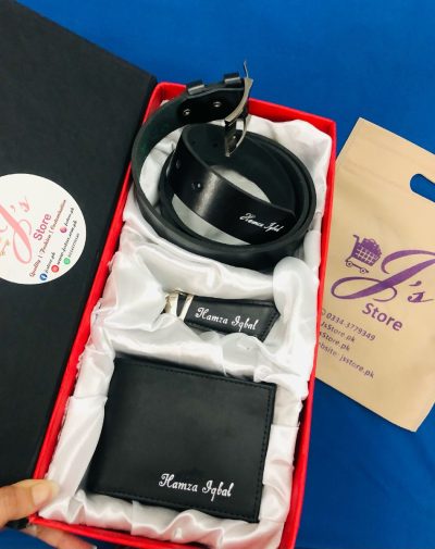 Customized Name Engraved Leather Wallet Keychain Belt Gift Set. It's a Leather gift set that includes a Wallet Keychain and Belt. All the items come with customized Name Engraving, packed in a beautiful gift box. The gift box inner has a white color silk cloth to give it a premium look. The box also has a fine red color edges with black color from outside. The gift set comes with black leather products and with silver name engraving.