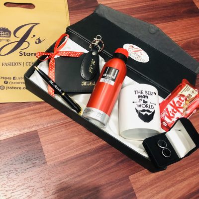 A curated Wallet Gift Set for Him. Comes with all the things that a man needs. A name negraved Wallet and Keychain. A Mug, Imported chocolate and shiny marble cuff-links.
