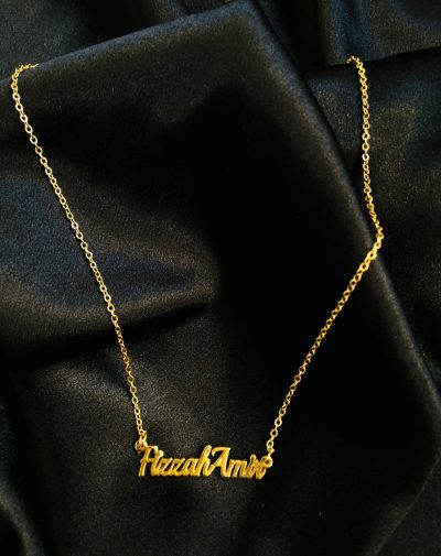Double Name Gold-Plated Necklace on a black background.