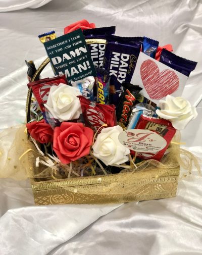 Chocolate Gift Basket For Anniversary comes with 16 Imported Chocolates and Decorated with mini cards, ribbons, fresh and artificial flowers.