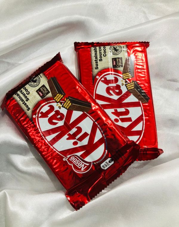 Pair of imported KitKats 4 Bars on a white silk background