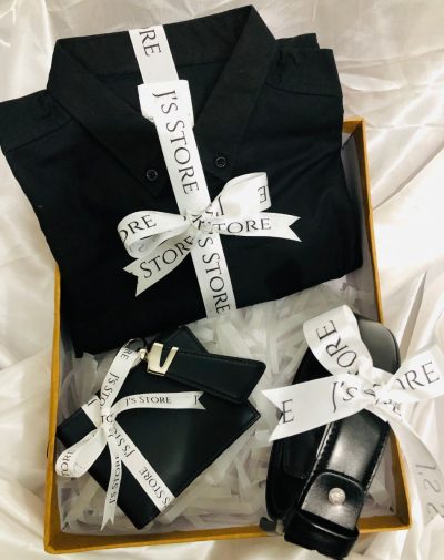 Man In Black for Anniversary gift set for him featuring a plain black casual shirt from ZARA, black leather wallet, keychain, and belt in a sleek gift box with a white ribbon from J's Store.