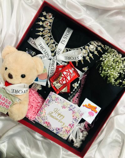 Wife For Life Anniversary Gift Box includes a 2 pc's fancy suit for woman, baby's breath bouquet, teddy bear, imported chocolates, and anniversary greeting card.