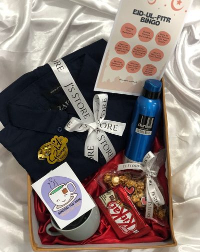 Curated Eid Joy Gift Box with stylish Zara shirt, teacups, KitKat bars, popcorn, deodorant, marble cufflinks, Eid-ul-Fitr bingo card game, and more.