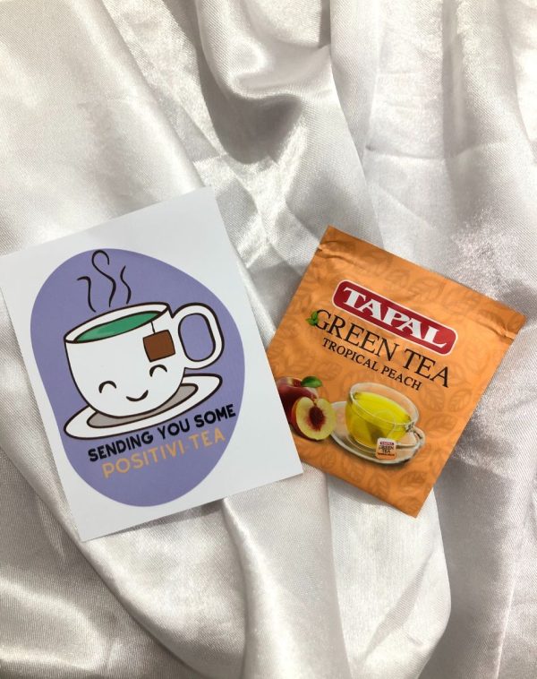 Tea Bag and a Mini Card with Tea Cup and Text (Sending you Some Postivi-Tea) written on it.