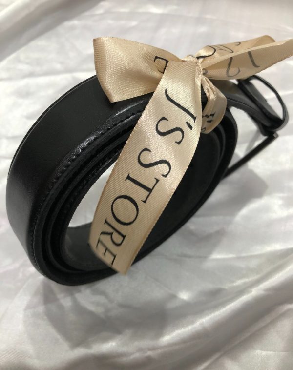 Plain Black Leather Belt - A rolled black belt wrapped with J's Store beige ribbon against a silk white background.