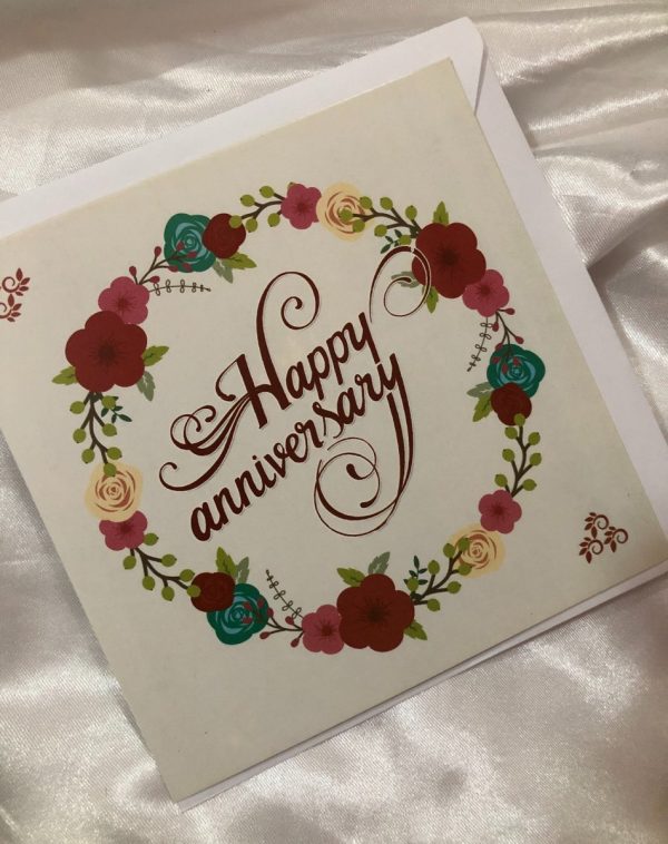 Anniversary Greeting Card from Marks and Spencer - Handwritten 'Happy Anniversary' in blood red, surrounded by floral pattern.