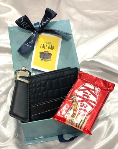 A small turquoise gift box - Budget-Friendly Father's Day Surprise with crocodile style wallet, leather keychain in 7 style design, and KitKat 4 bars.