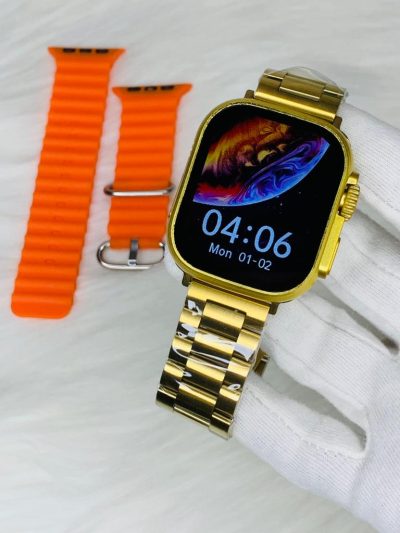 Series 8 Ultra GOLD Edition with Orange Strap in hand on a white background