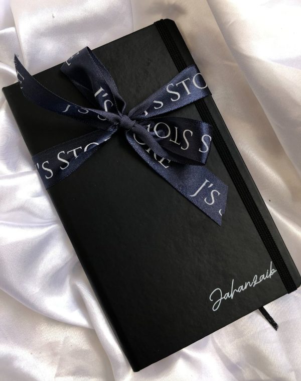 Custom Leather Notebook on White Silk Background - A5 size, Black Cover with Silver Name Engraving.