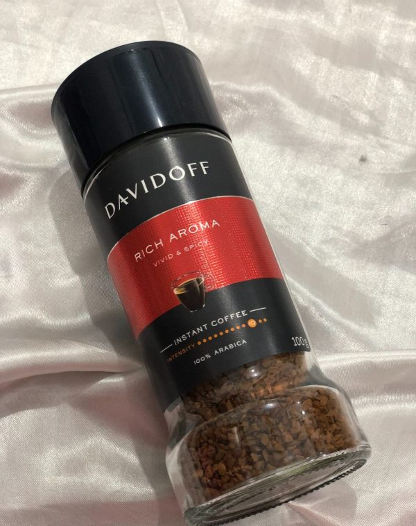 DavidOff Coffee Jar for Romantic Mornings on White Silk Background.