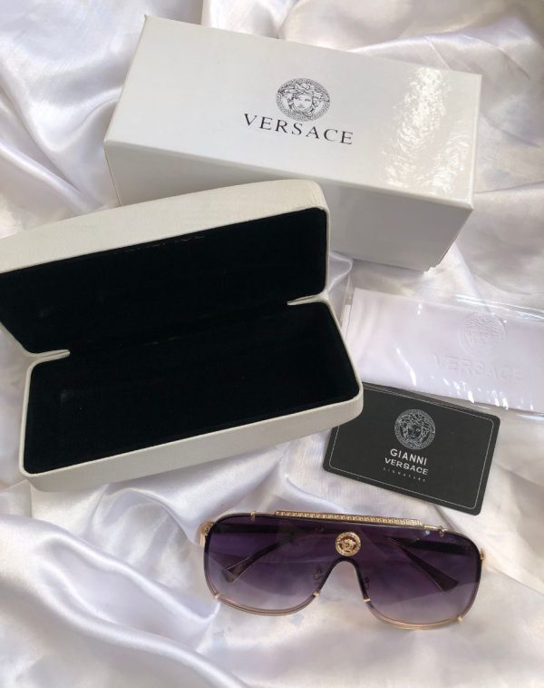 Elevate your style with authentic Versace sunnies. White frames, premium accessories, exclusive J's Store offer.