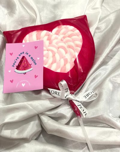 Skip the ordinary treats and share the love with J's Store's adorable heart-shaped marshmallows, each wrapped in a kiss of red and perched on a sturdy stick.