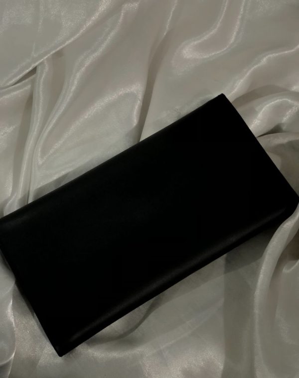 The back view of a Black Bridle Leather trifold wallet from J's Store. It features a flap closure and is crafted from premium leather. Presented against a clean white backdrop.