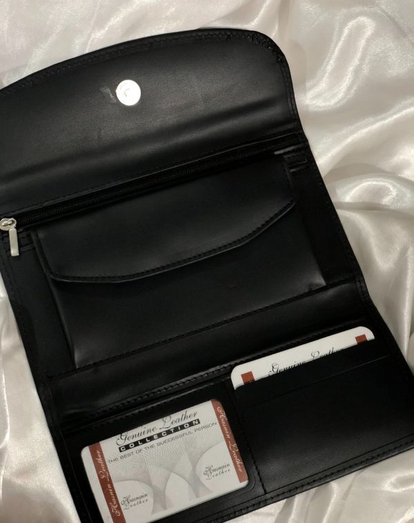 A Black Bridle Leather trifold wallet from J's Store. It features a flap closure and is crafted from premium leather. Presented against a clean white backdrop. It has been made for convenience with lots of pockets, card slots and small coin compartment.