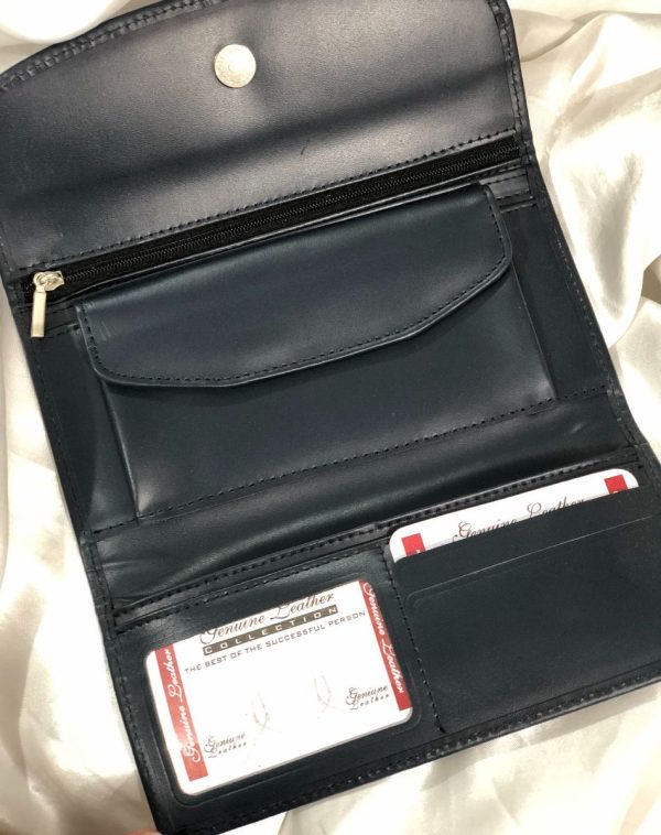 A Grey Bridle Leather trifold wallet from J's Store. It features a flap closure and is crafted from premium leather. Presented against a clean white backdrop. It has been made for convenience with lots of pockets, card slots and small coin compartment.