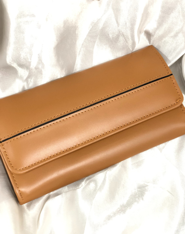 Camel Classic Carry Leather Wallet from J's Store with a stripy detailing on the flap. Kept against white background.