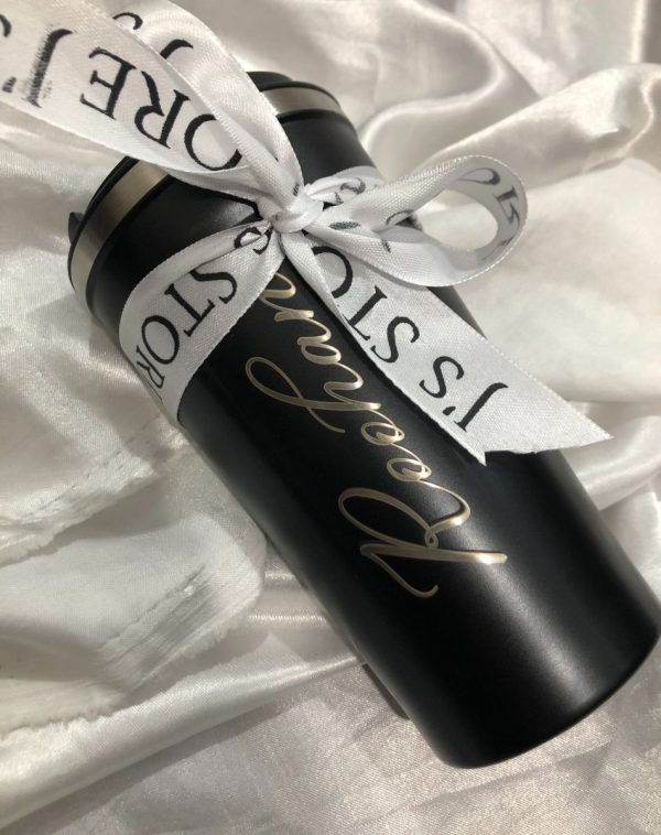 A temperature display coffee mug with J's Store ribbon on and had name engraving.