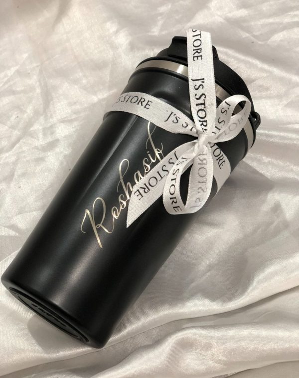 A temperature display coffee mug with J's Store ribbon on and had name engraving.