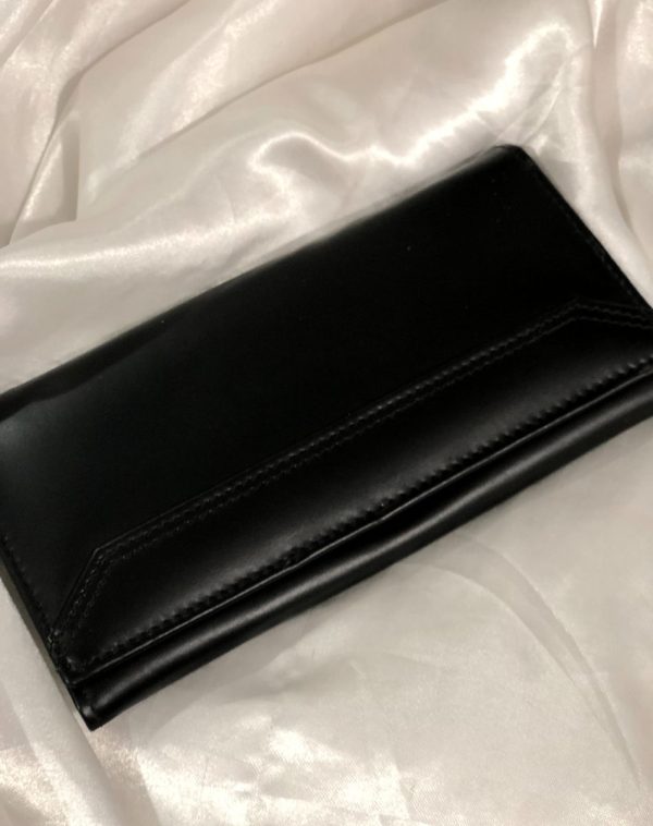 The Everyday Leather Wallet in Black with same color leather accent and stitching.