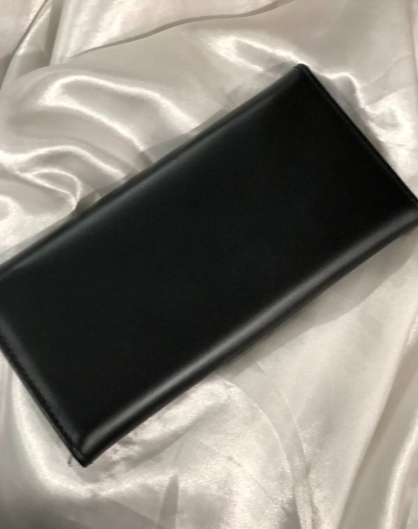 Back view of the The Everyday Leather Wallet in Black color with same color leather accent and stitching. It is put against the white background.