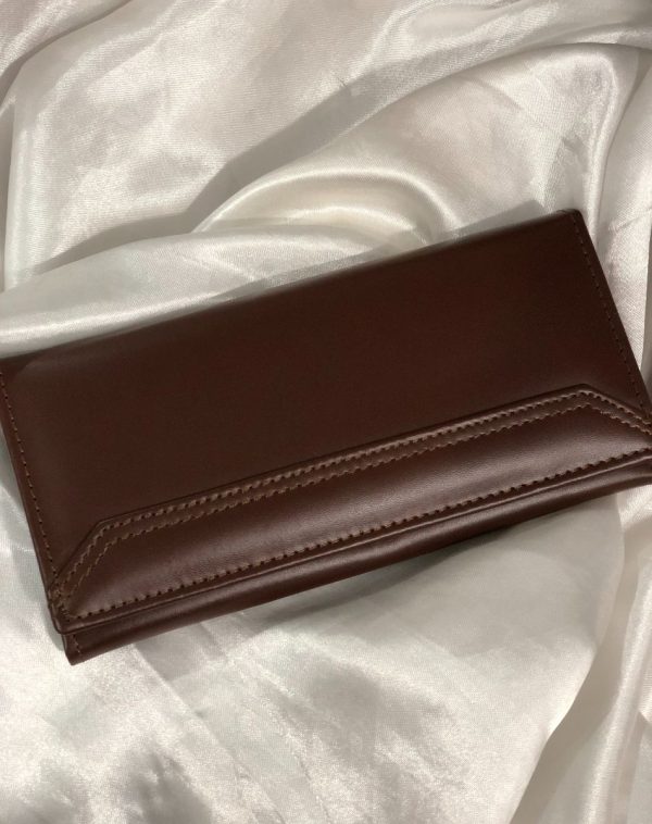 The Everyday Leather Wallet in Dark Brown with same color leather accent and stitching.
