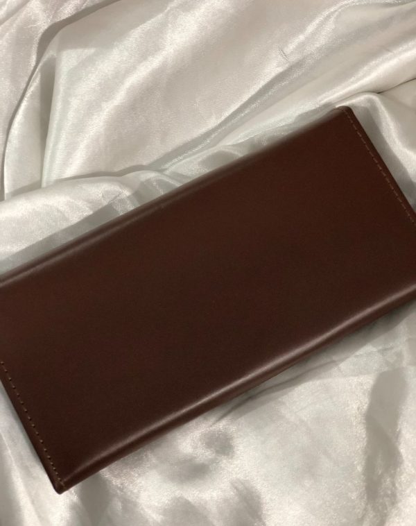 Back view of the The Everyday Leather Wallet in Dark Brown color with same color leather accent and stitching. It is put against the white background.