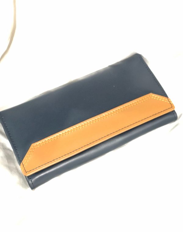 The Everyday Leather Wallet with a mustard leather accent and stitching.