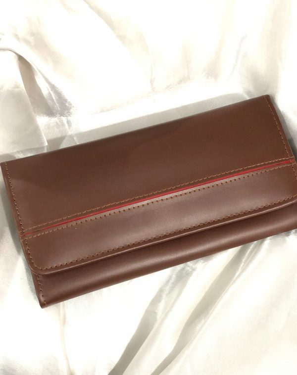 Dark Brown Timeless Leather Wallet from J's Store with a stripy detailing on the flap. Kept against white background.