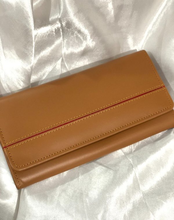 Camel Timeless Leather Wallet from J's Store with a stripy detailing on the flap. Kept against white background.