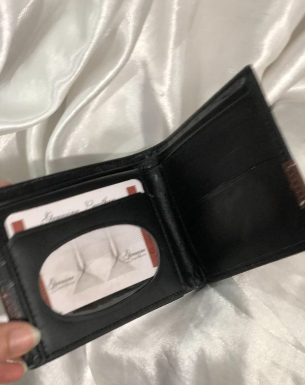 J's Store Crocodile Leather Wallet For Men in black. Here you can see the inside of the product with card slots that are evident right when you open the wallet, making it easy for you to reach out for the important cards or some receipt.