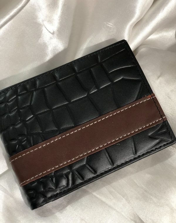 J's Store Crocodile Leather Wallet For Men in Black, with a dark brown strip stitched over it for its enhancement. The wallet has a crocodile pattern embossed over it, which is making it an ideal choice for you to buy for your regular use.