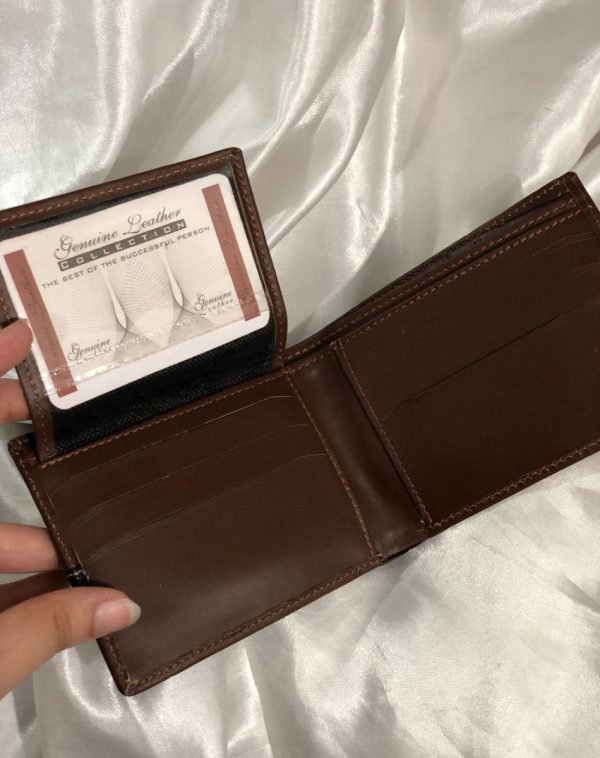 The flap of Dark Brown Crocodile Leather Wallet For Men has been lifted to reveal more card slots.