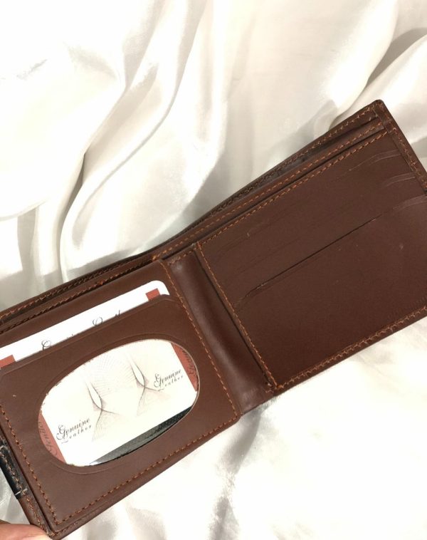 J's Store Crocodile Leather Wallet For Men in Dark Brown. Here you can see the inside of the product with card slots that are evident right when you open the wallet, making it easy for you to reach out for the important cards or some receipt.