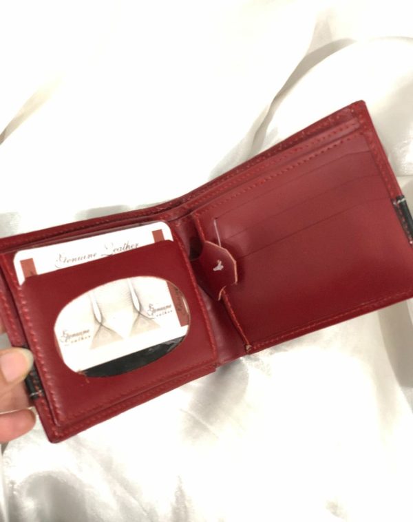 J's Store Crocodile Leather Wallet For Men in Maroon. Here you can see the inside of the product with card slots that are evident right when you open the wallet, making it easy for you to reach out for the important cards or some receipt.