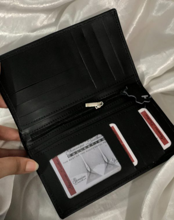 A sleek Long Leather Wallet for Men in Black colour. It is manufactured with lots of card holders, pockets and other slots for receipts, cash or anything else that an be fixed into this smart wallet.
