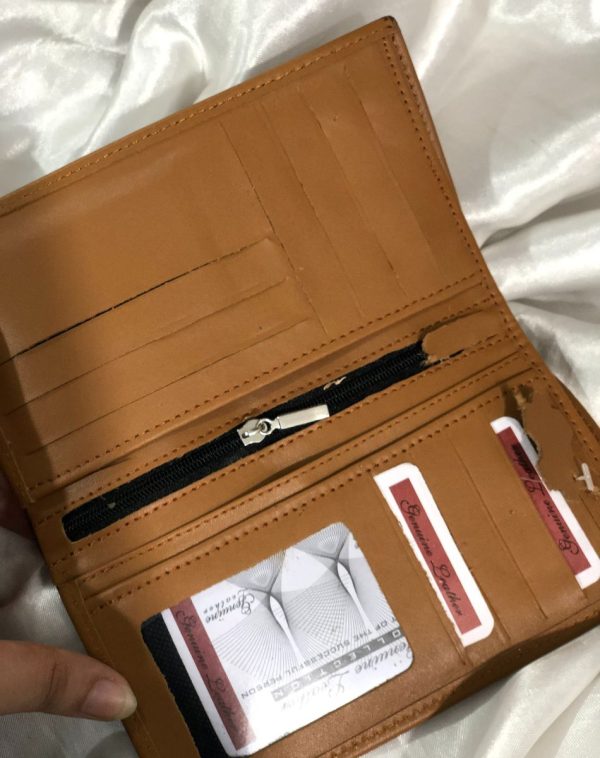 A sleek Long Leather Wallet for Men in Camel color. It is manufactured with lots of card holders, pockets and other slots for receipts, cash or anything else that an be fixed into this smart wallet.