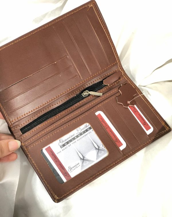 A sleek Long Leather Wallet for Men in dark brown color. It is manufactured with lots of card holders, pockets and other slots for receipts, cash or anything else that an be fixed into this smart wallet.