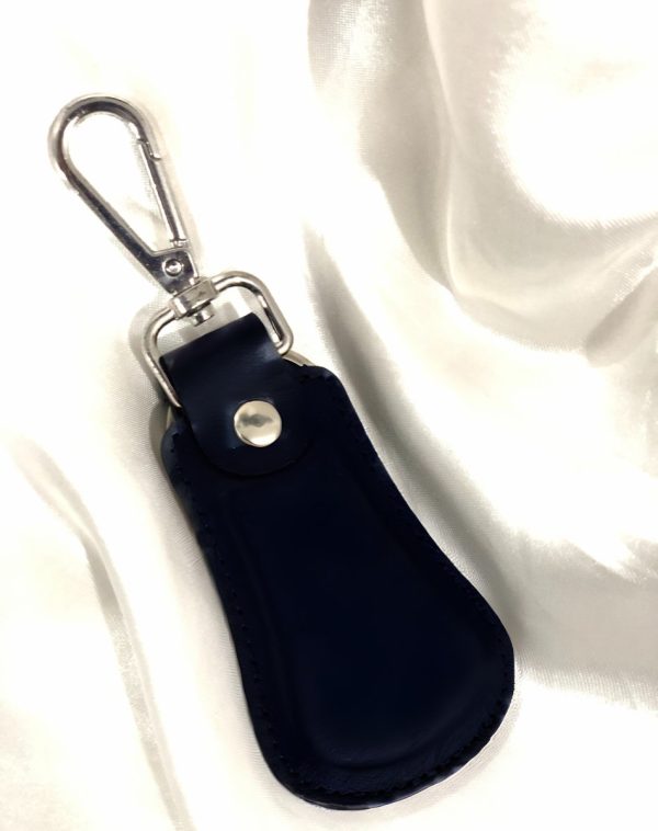Black Elegant Curved Leather Keychain by J's Store with a sleek design and metallic clasp.