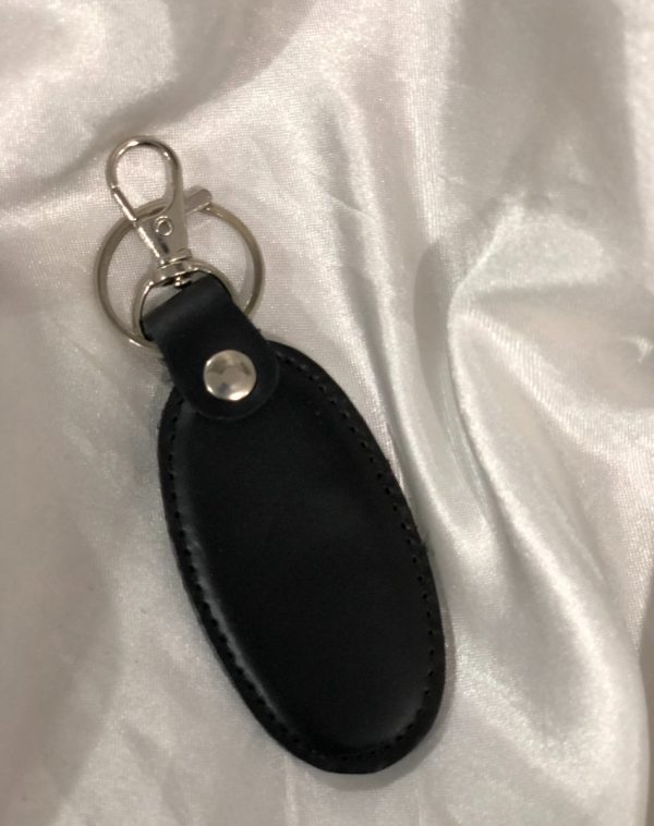 A black Simple Leather Keychain with a silver hook, designed for durability and elegance.