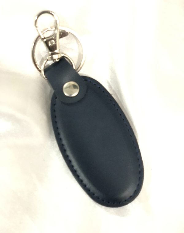 A blue Simple Leather Keychain with a silver hook, showcasing minimalist design and style.