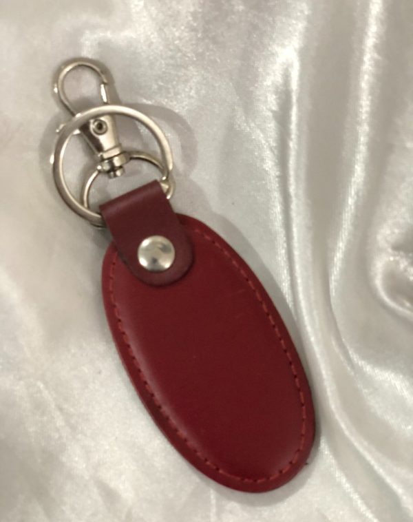 A maroon Simple Leather Keychain featuring premium leather and a silver hook, perfect for gifting.
