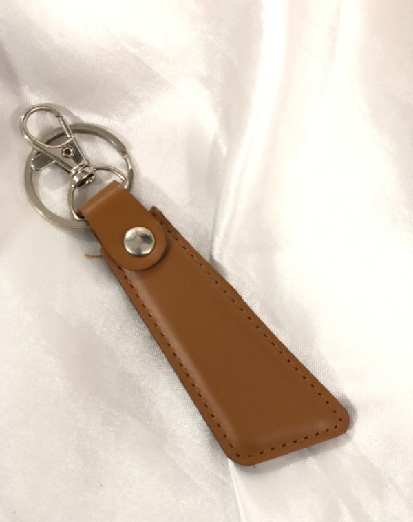 Camel Sleek Leather Keychain by J's Store with elegant craftsmanship and a polished finish.