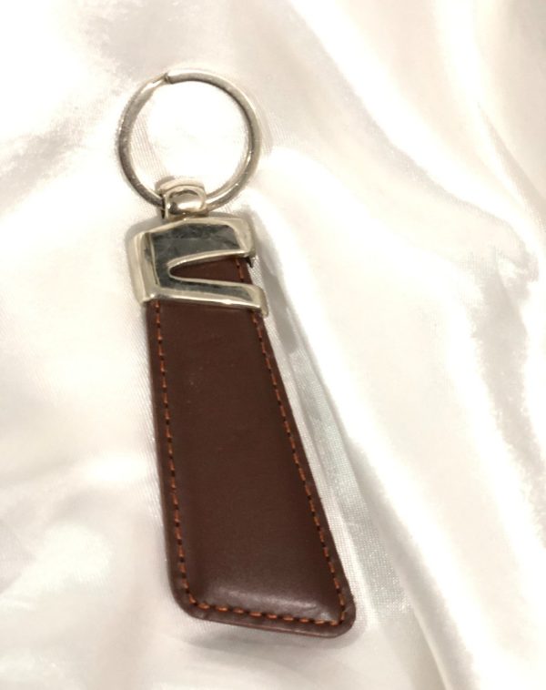 Brown Z-Accent Leather Keychain by J's Store featuring a classic color and stylish metallic accent.
