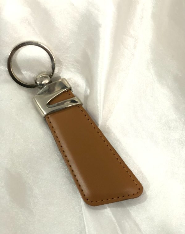 Camel Z-Accent Leather Keychain by J's Store, showcasing an elegant leather texture and metallic accent.