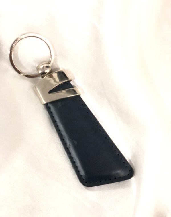 Blue Z-Accent Leather Keychain by J's Store with sleek leather design and metallic detailing.